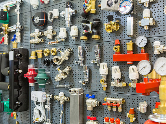 Steel and brass plumbing fittings in a plumbing supply store