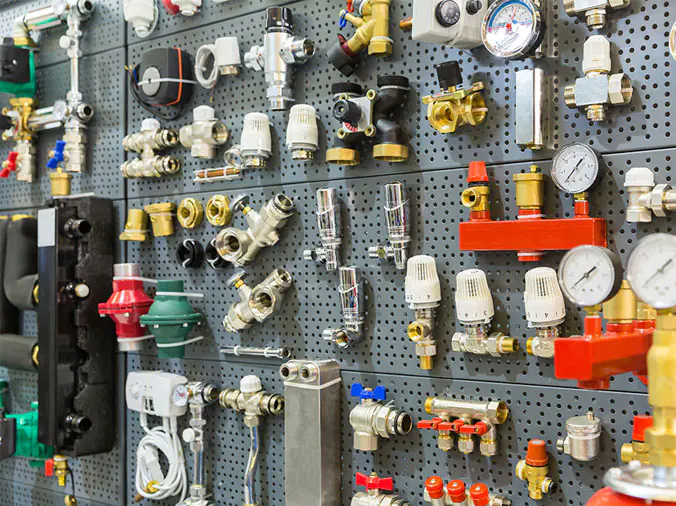 Steel and brass plumbing fittings in a plumbing supply store