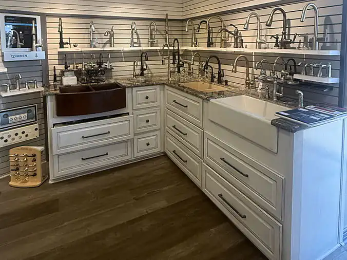 Kitchen sink faucets on display in the Brazosport Bath & Kithcen Showplace in Clute, Texas